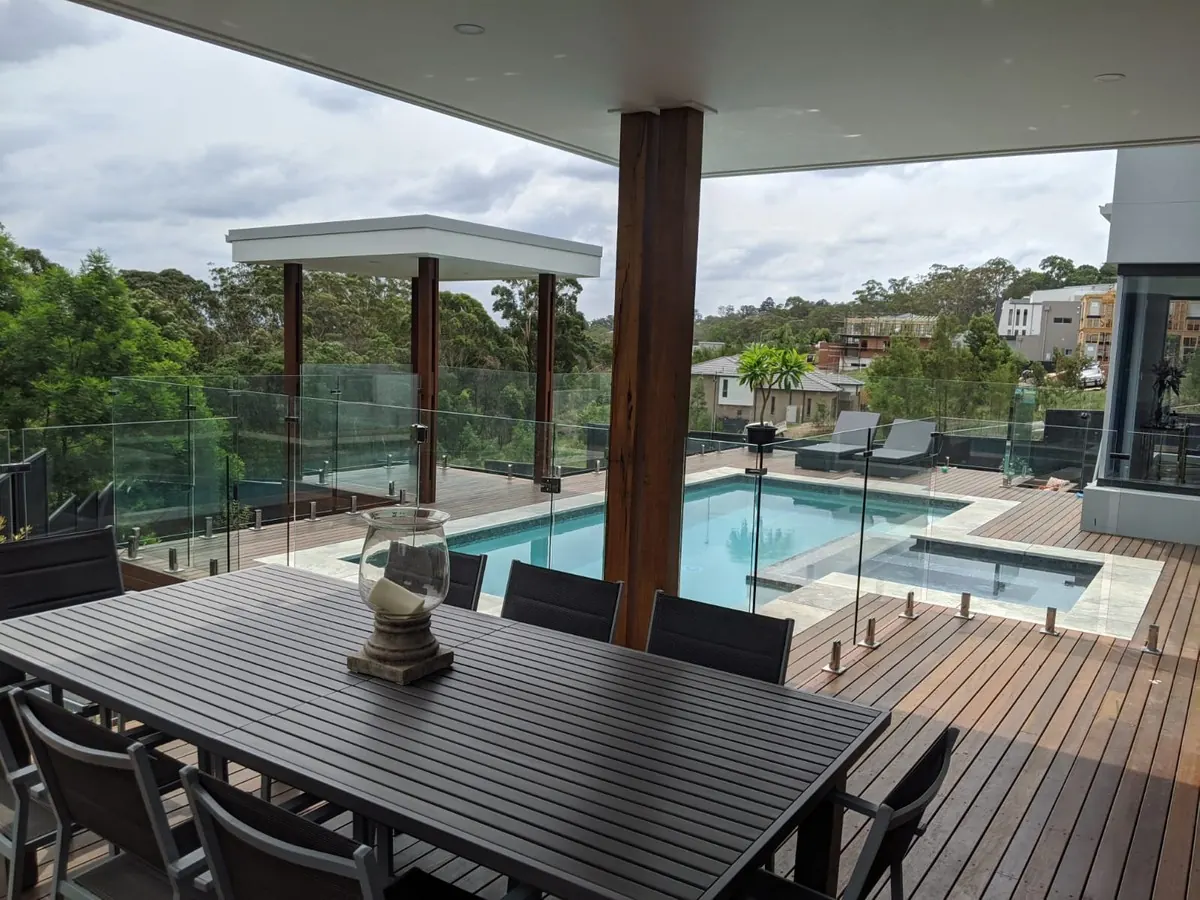 Frameless glass pool fencing around a modern Gold Coast home pool